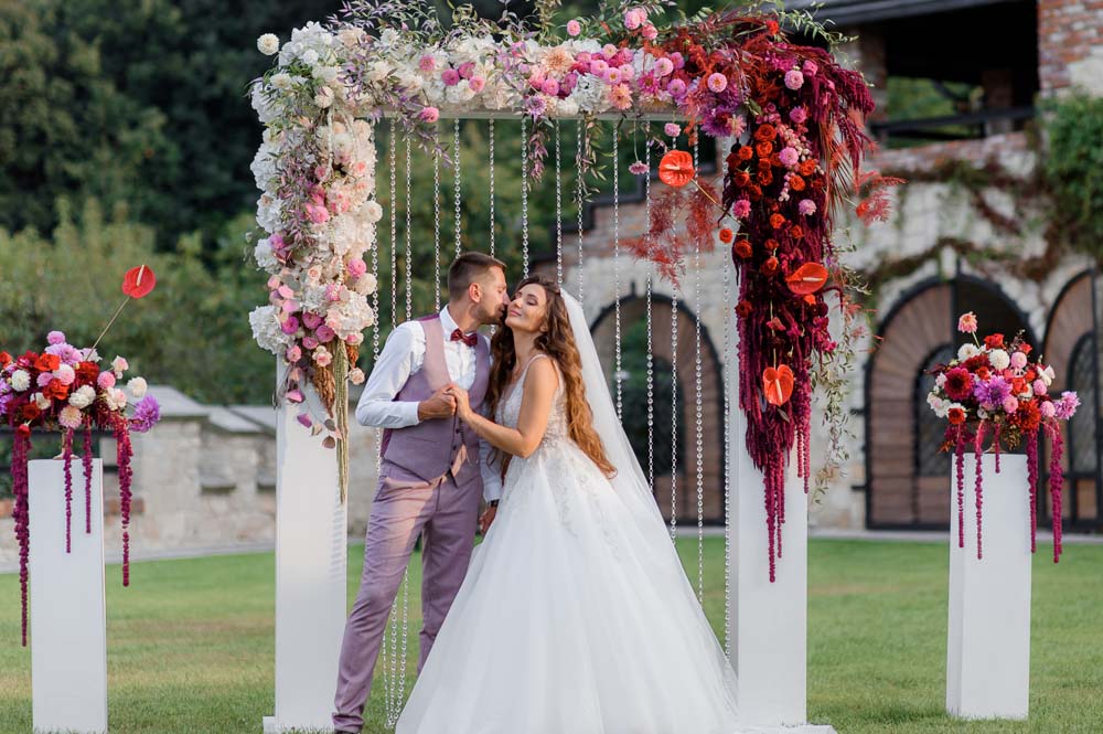 wedding-archway-backyard-happy-wedding-couple-outdoors-before-wedding-ceremony