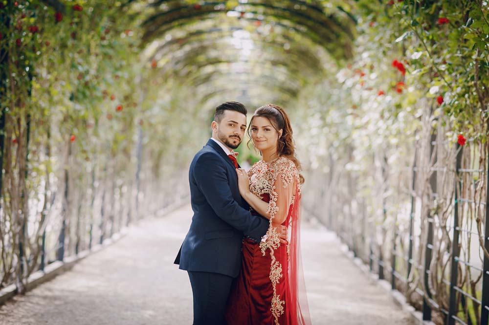 beautiful-woman-long-red-dress-walks-around-city-with-her-husband